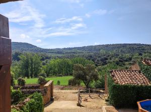 a view of the hills from a house at masia riu dels arbres in Benasal