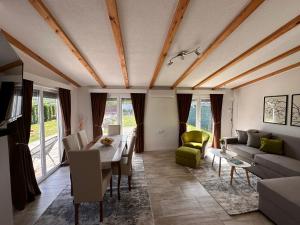 a living room with a table and a couch at Holiday Home Emma in Bihać