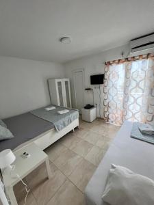 Postel nebo postele na pokoji v ubytování IN Villa Guesthouse