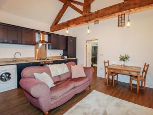 a living room with a couch and a table at The Old Parlour in Rhyl