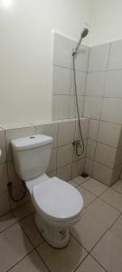 a white toilet in a bathroom with a shower at URBAN DECA Homes SM EAST Pasig in Manila +19 photos