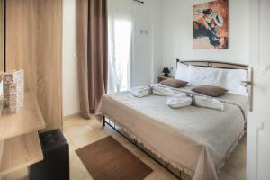 Postel nebo postele na pokoji v ubytování Afrathias Beachhouse - Cretan Hideaway