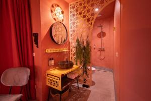 a bathroom with a sink and a toilet in a room at Boutiquehotel The Church in Arnhem