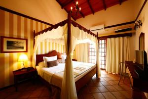 Cama ou camas em um quarto em Manary Praia Hotel