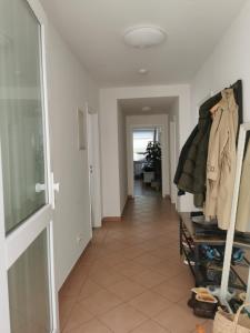a hallway with a room with a closet and a walkway at Center Schwabing Spacious flat in Munich