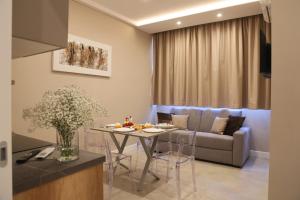 a living room with a table and a couch at Freedom in SantʼAntonio Abate
