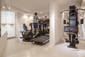 two men working out in a gym with tread machines at Canaves Oia Suites & Spa in Oia