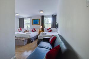 Postel nebo postele na pokoji v ubytování Lamont Hotel + 18 fotografií
