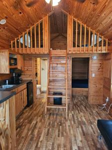 a wooden cabin with a bunk bed in it at Wheeler Lake Riverbend Haven 2 in Stilwell