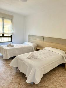 Postel nebo postele na pokoji v ubytování Apartamentos Rurales Flor de la Alcarria