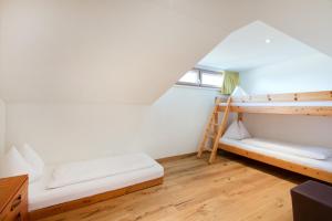 a room with two bunk beds and a ladder at Familienhotel Lagant in Brand +55 photos