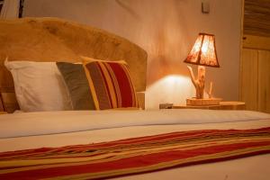 Postelja oz. postelje v sobi nastanitve Embogo Safari Lodges