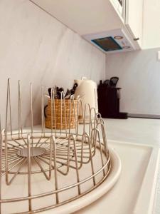 a wire rack on top of a kitchen counter at Eden in Saint-Tropez