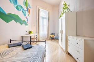 Posteľ alebo postele v izbe v ubytovaní Gellerico Rooms at Rákóczi Square