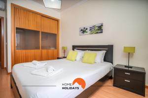 Giường trong phòng chung tại #203 Casinha da Ana by Home Holidays +33 ảnh