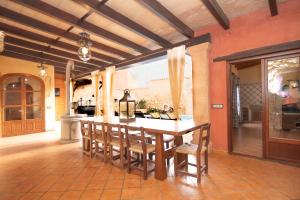 a kitchen with a table and chairs in a room at 243 Villa Can Bassa ETV3623 by Mallorca Charme in Muro