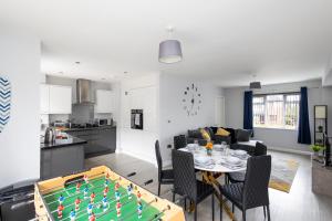 a kitchen and a living room with a pool table at Leeds 3 Bed - Parking, Self Check-in, En-suite, WiFi, Fussball, Garden - Groups, Contractors, Families, Long Stays - Alt-Stay in Bramley