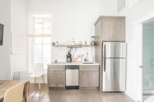 a kitchen with a stainless steel refrigerator at Cute & Cozy - Perfect for Business or Leisure in Covington