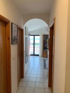 a hallway with an archway in a house at Apartment Domi in Starigrad