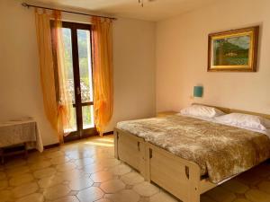 A bed or beds in a room at Agriturismo Rocca Dei Marchesi