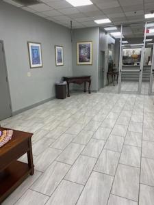 a large room with a tile floor and a table at Barclay Hotel Atlanta Downtown in Atlanta