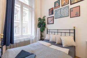 Posteľ alebo postele v izbe v ubytovaní Gellerico Rooms at Rákóczi Square