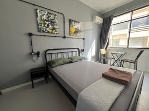 Posteľ alebo postele v izbe v ubytovaní Urban Rooms