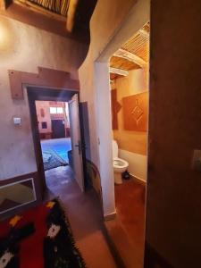 a view of a bathroom with a toilet in a room at Gorges View Dades in Tamellalt