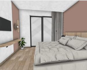 een slaapkamer met een groot bed en een televisie bij Roula Kotsonis Superior Apartment in Argassi