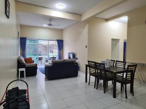 a living room with a table and chairs at The Simplicity Homestay in Tanah Rata +18 photos