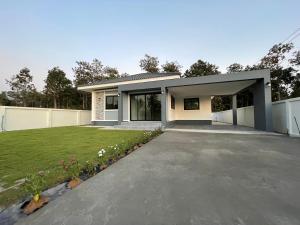 a rendering of a house with a driveway at บ้านพูลทรัพย์วิลเลจ POONSUB VILLAGe in Ban Na Charoen