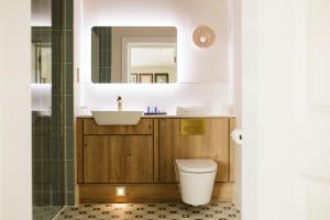 a bathroom with a toilet and a sink at The Hillbrook Hotel - Sherborne in Sherborne +41 photos