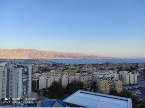 a view of a city with buildings and a body of water at Eilat in Eilat