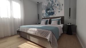 Posteľ alebo postele v izbe v ubytovaní Apartman Spalatum