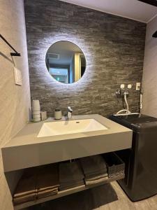 a bathroom with a sink and a mirror at Domaine Bless in Niki +19 photos