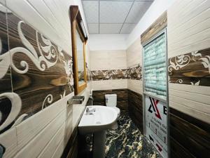a bathroom with a sink and a sink at Sigiriya Moonlight Home in Sigiriya +122 photos