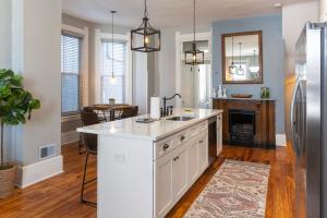 a kitchen with a sink and a counter top at The Main Event Enjoy Private Parking in Covington +16 photos