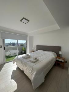 Giường trong phòng chung tại Fk Villa Devoto