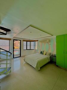 a bedroom with a bed and a staircase in it at Hostal Panama Experience in Panama City