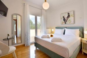 Ένα ή περισσότερα κρεβάτια σε δωμάτιο στο Bella Dassia