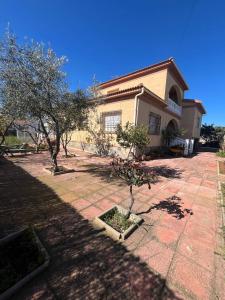 a house with trees in front of it at Casa Polícar Marta in Polícar
