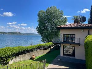 a house with a view of the water at La Limonaia-charme & lake view in Meina