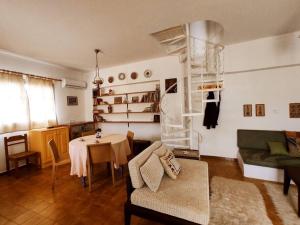 a living room with a table and a couch at Απόλλων in Apóllona
