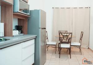 a kitchen with a table and chairs and a refrigerator at Casa 65 San Miguel in San Miguel