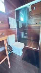 a bathroom with a toilet and a shower at Pousada Amor Do Arpoador in Tutóia