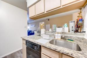 a kitchen with a sink and a dishwasher at Elegant Houston Hub MedCtr,NRG,Galleria,Museum District in Houston