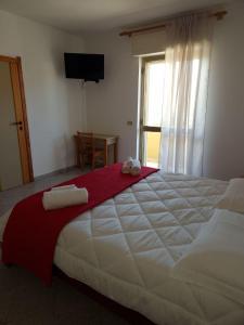Ένα ή περισσότερα κρεβάτια σε δωμάτιο στο Hotel Mistral