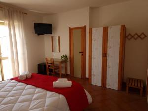 Ένα ή περισσότερα κρεβάτια σε δωμάτιο στο Hotel Mistral