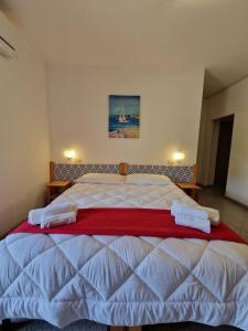Ένα ή περισσότερα κρεβάτια σε δωμάτιο στο Hotel Mistral