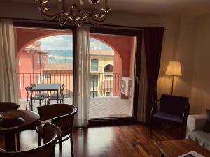 a living room with a sliding glass door to a balcony at Apartment Aurelia in Muggia